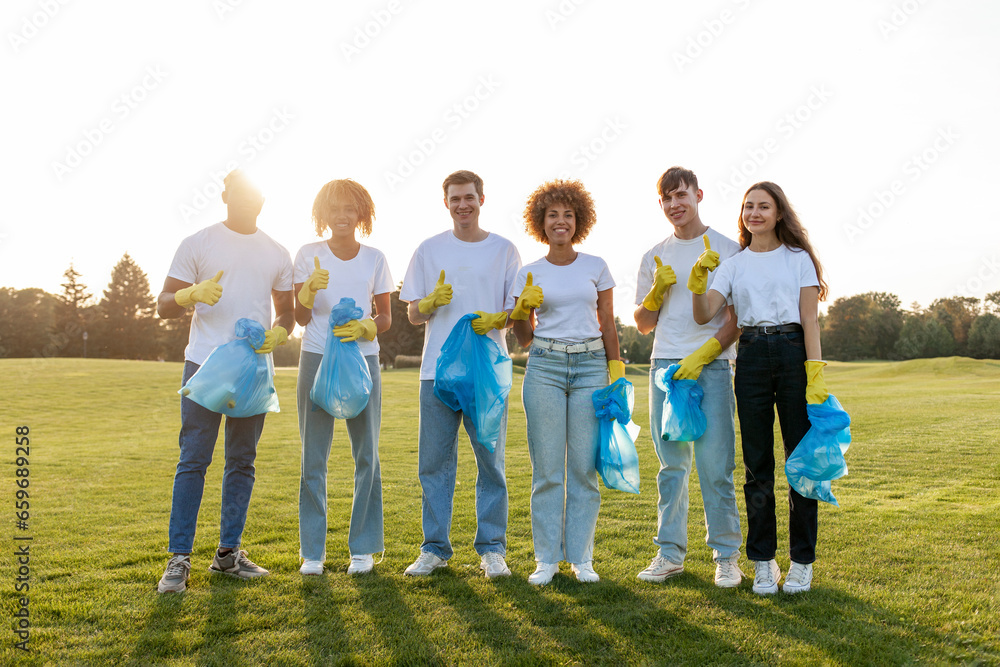multiracial group of people volunteers in gloves with garbage bags collect garbage and plastic in the park multiracial group of people volunteers in gloves with garbage bags collect garbage and plastic in the park