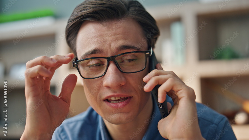 Closeup smiling businessman calling smartphone at office. Man mobile phone call Closeup smiling businessman calling smartphone at office. Man mobile phone call