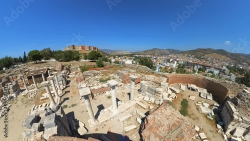 Kapija Progona Roman ruins in Selcuk, echoes past as tourists explore ancient shops, temples, and homes, revealing vibrant history of this once-thriving city. A captivating journey through time. photo