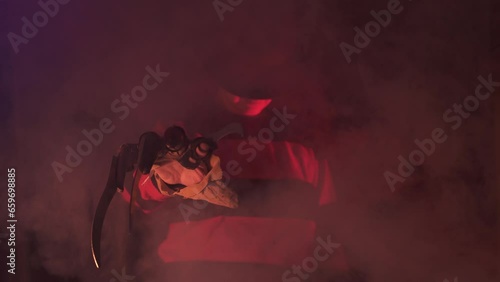 scary hand of  man is like a serial killer freddy with a glove sharp knives in the mist, background for Halloween photo