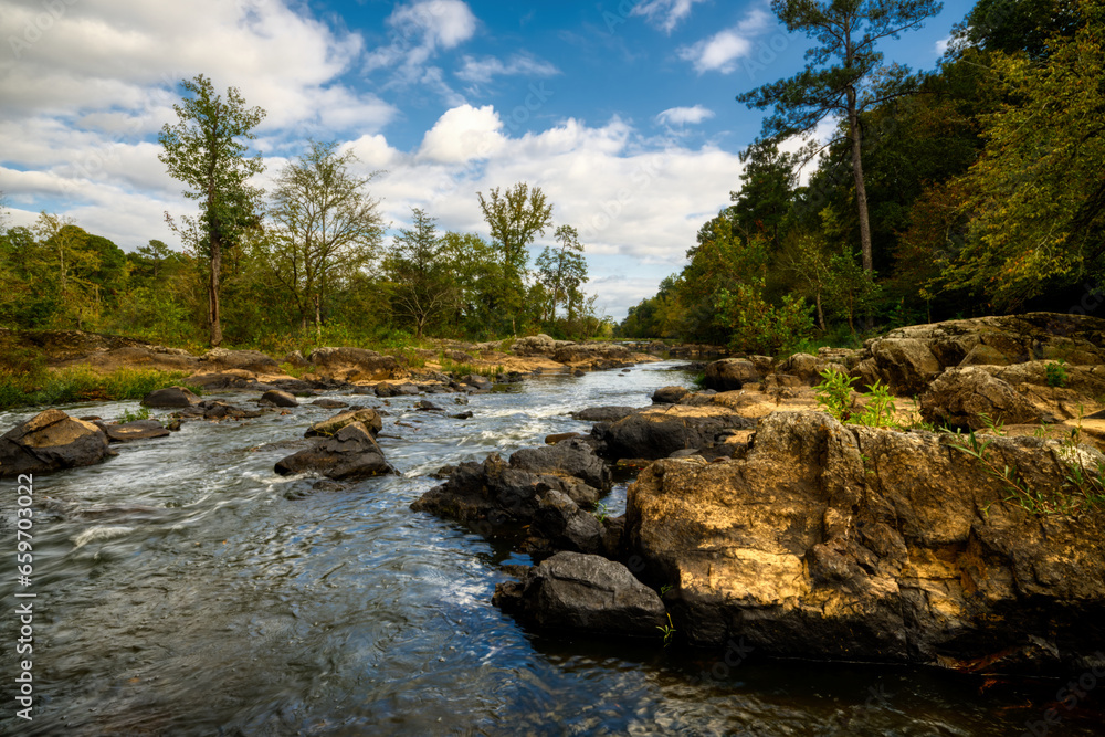 A river landscape in summer of the Haw River in North Carolina. A river landscape in summer of the Haw River in North Carolina.