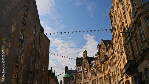 Victoria Street in downtown Edinburgh decorated with flags for the August party, Scotland.