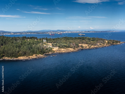 Freighters anchored off the Southern tip of Vancouver Island overlooking downtown Victoria British Columbia.