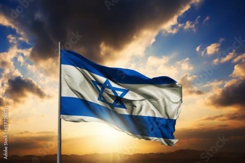 Israel flag against the sunset sky. Patriotism concept. Background with selective focus and copy space © top images