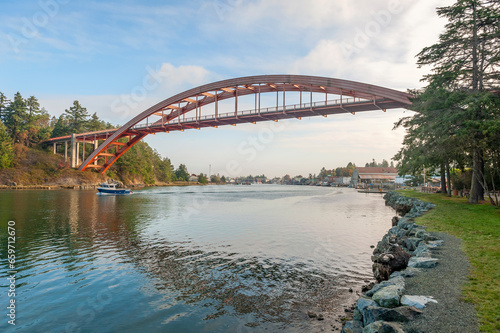 La Conner is a popular tourist town in the heart of the Skagit Valley, Washington. Rainbow Bridge connects Fidalgo Island and La Conner, crossing Swinomish Channel in Skagit County, Washington.  photo