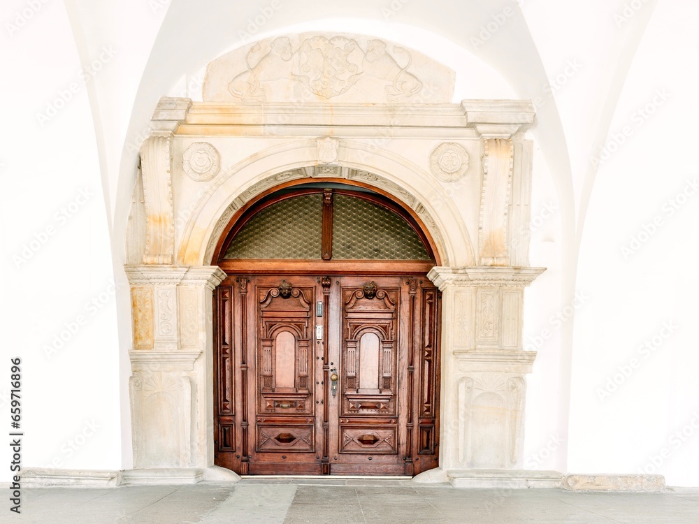 Beautiful old door in a stone house in the old town of Krosno, Poland. - obrazy, fototapety, plakaty 