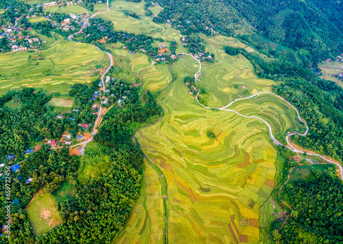 Mountainous ripen rice fields in Pu Luong, Vietnam viewed from the air. photo