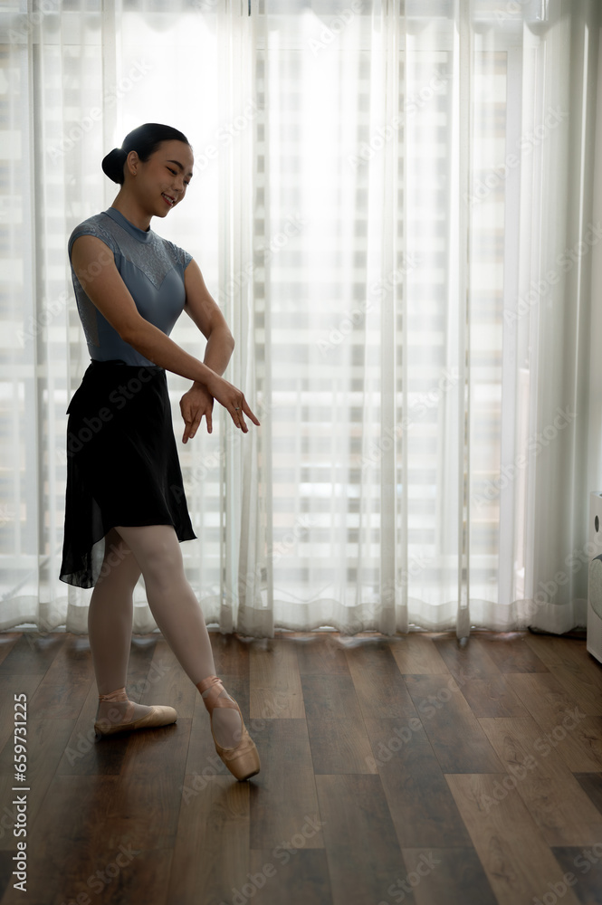 Young graceful ballet dancer in tights and leotard practicing new movement for performance. Young graceful ballet dancer in tights and leotard practicing new movement for performance.