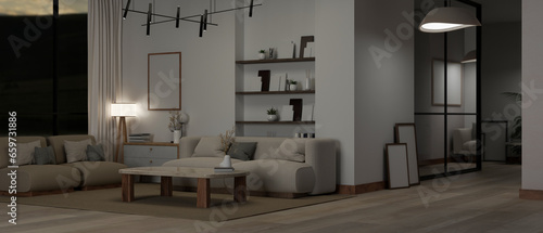 Interior design of a modern spacious living room at night with couches, a coffee table, and decor.