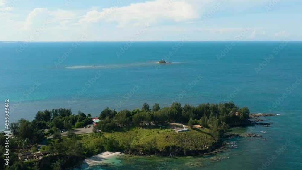 Aerial drone of Seascape with tropical sandy beach and blue ocean. The Tip of Borneo. Kalampunian Beach. Borneo, Malaysia. Aerial drone of Seascape with tropical sandy beach and blue ocean. The Tip of Borneo. Kalampunian Beach. Borneo, Malaysia.