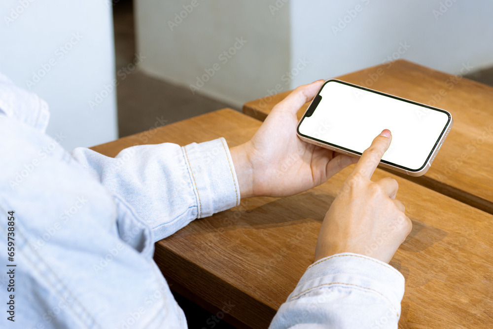 Blank screen smart isolated on white. Woman holding and using mobile phone at home. Technology and new lifestyle concept. Blank screen smart isolated on white. Woman holding and using mobile phone at home. Technology and new lifestyle concept.