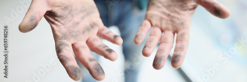 Photography Man shows dirty hands after wiping dust on bookshelves