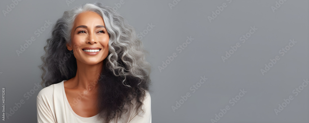 Black middle age woman portrait with healthy face skin. Open smiling ...