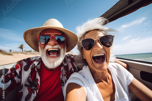 Happy senior retired couple enjoying summer road trip vacation