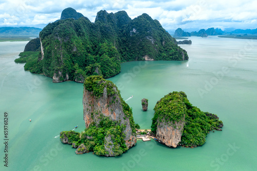 Khao Tapu, James Bond Island, aerial shot from a drone, blue sea, emerald green, is a popular tourist attraction in Southern Thailand. © Theerawat