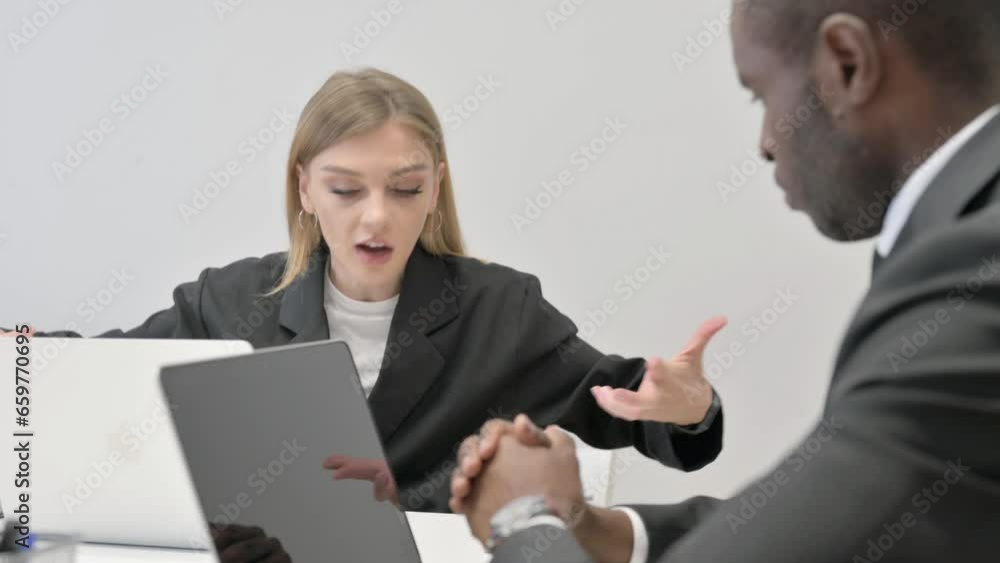 Angry Businesswoman Talking with African Businessman in Office Angry Businesswoman Talking with African Businessman in Office