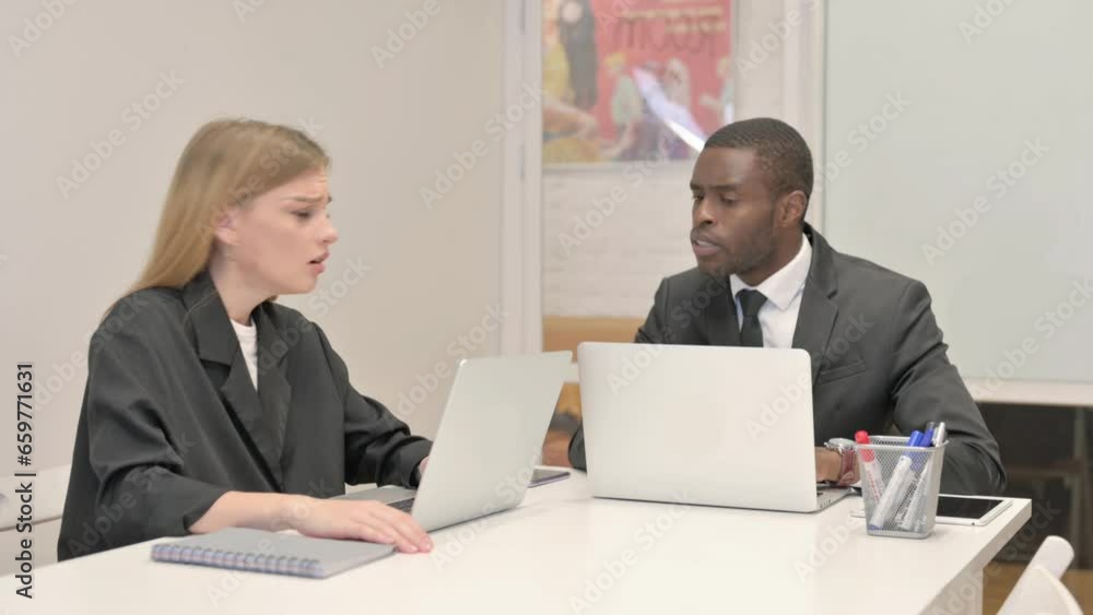 Businesswoman Reacting to Loss with African Businessman in Office Businesswoman Reacting to Loss with African Businessman in Office