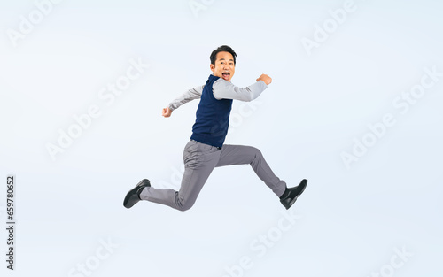 ジャンプするミドル男性（切り抜き背景透過PNGも販売しております。作成者リンクから「PNG」で検索してください） © metamorworks