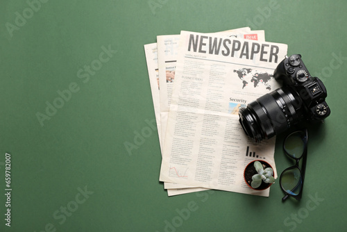 Newspapers with photo camer...