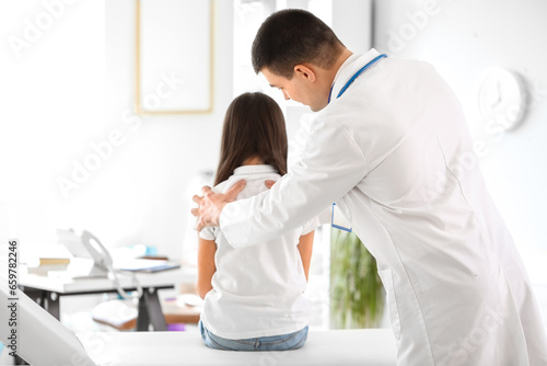Doctor checking posture of ...