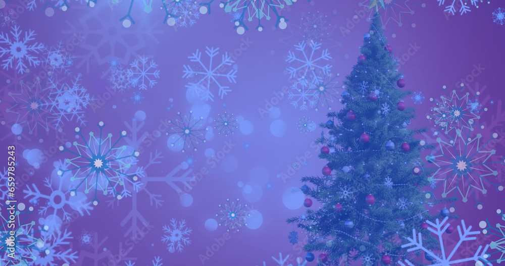 Image of snow falling over christmas tree in winter scenery Image of snow falling over christmas tree in winter scenery