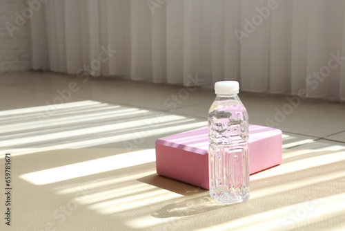 Bottle of water with block ...