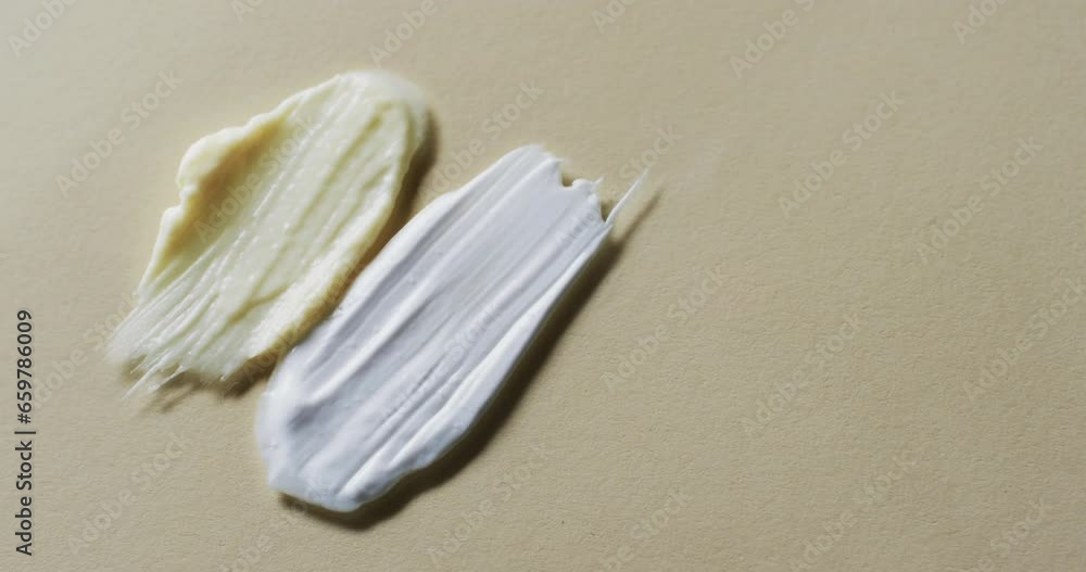 Video of make up smudges with copy space on brown background Video of make up smudges with copy space on brown background