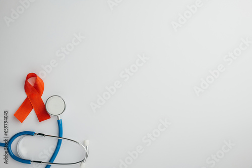 Stethoscope and red AIDS ribbons, viewed from the top, isolated on white. A symbol of support and hope in the battle against HIV. Give me this.