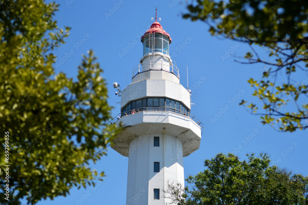 Partial close-up photo of a lighthouse on the seaside Partial close-up photo of a lighthouse on the seaside
