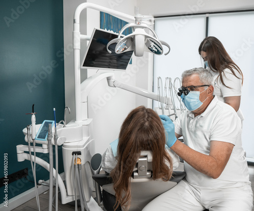 Modern methods of treating caries and other diseases of the oral cavity in the clinic. Patient Can Trust Dentist With Dental Assistant