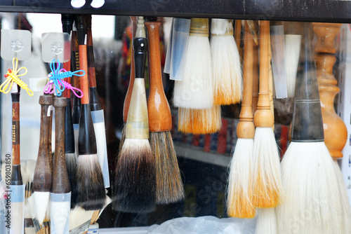 Photo of traditional Chinese writing instruments brushes for sale in a shop photo