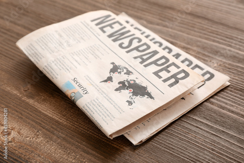 Morning newspapers on woode...