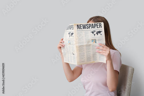 Woman reading morning newsp...