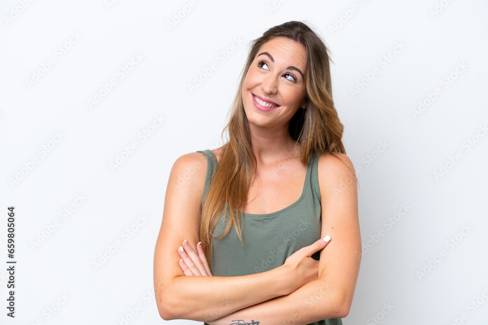 Young caucasian woman isolated on white background looking up while smiling Young caucasian woman isolated on white background looking up while smiling