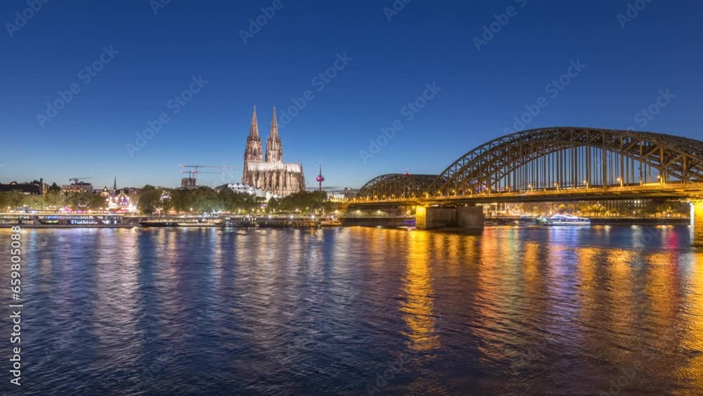 Cologne city ksyline aerial view night time lapse from day to night view of cologne cathedral dom church old town river and bridge. Cologne city ksyline aerial view night time lapse from day to night view of cologne cathedral dom church old town river and bridge.