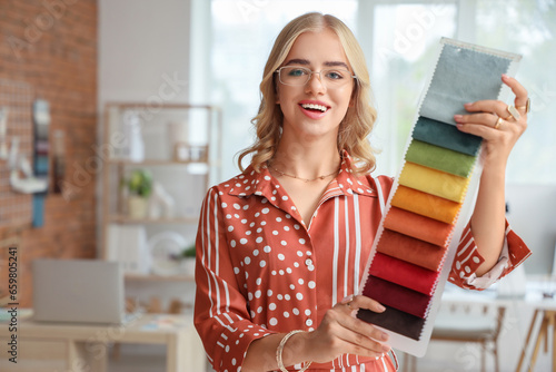 Smiling interior designer h...