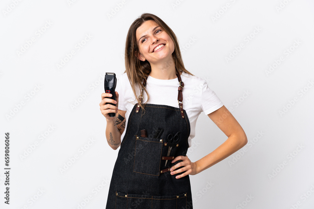Young hairdresser slovak woman isolated on white background posing with arms at hip and smiling Young hairdresser slovak woman isolated on white background posing with arms at hip and smiling