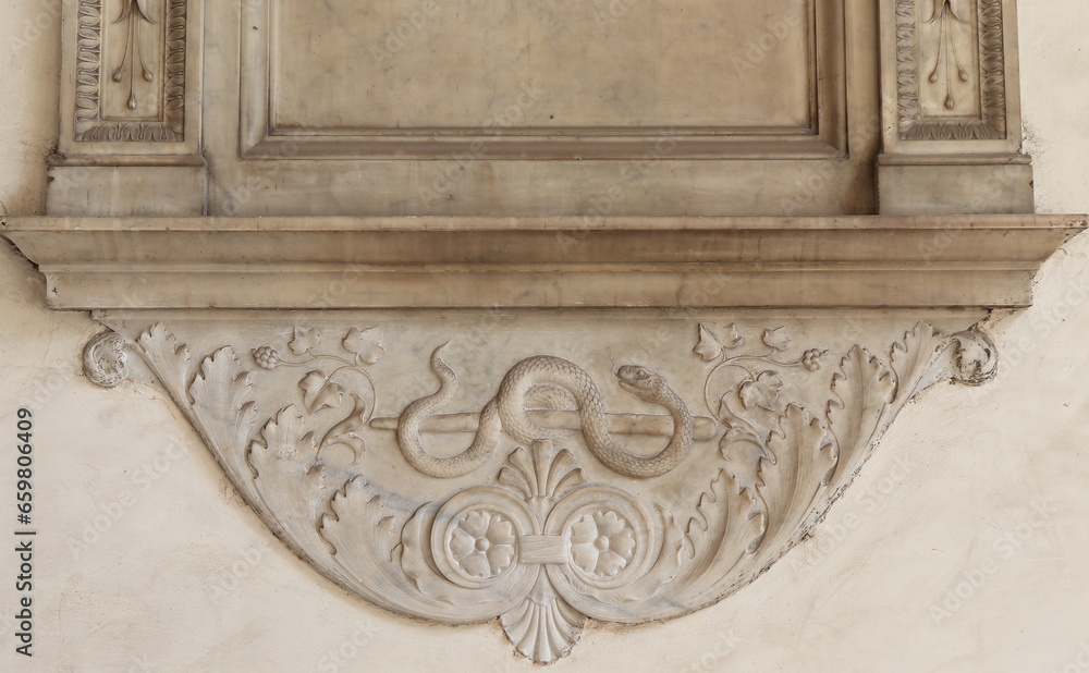 Sculpted Detail with a Snake at the San Marco Basilica Portico in Rome, Italy