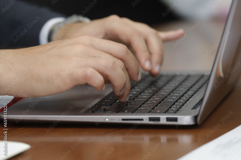 person typing on a laptop person typing on a laptop