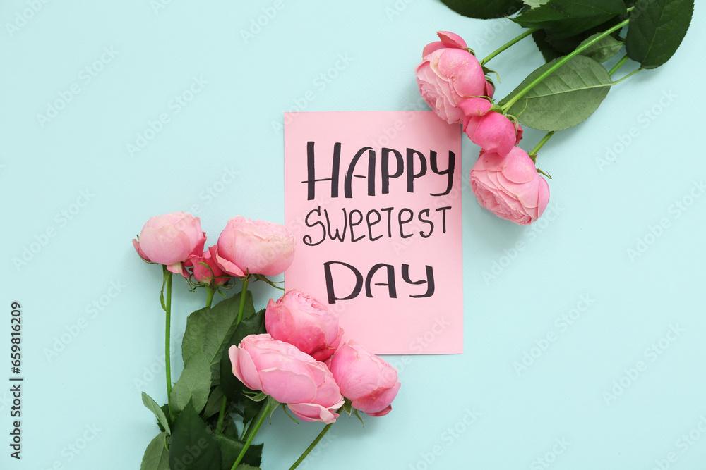 Card with text HAPPY SWEETEST DAY and roses on blue background - obrazy, fototapety, plakaty 