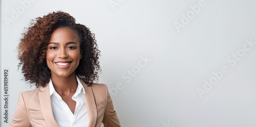 Fototapeta Portrait of African business woman in smart suit