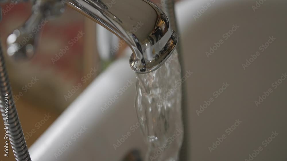 Tap running water in slow motion Tap running water in slow motion