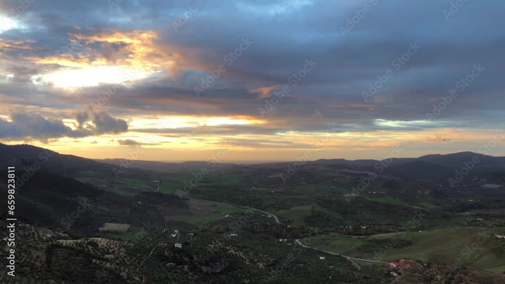 Pan Time lapse shot of vast landscape: farmlands, valley, mountains, hills. At Zahara de la Sierra, Spain. Pan Time lapse shot of vast landscape: farmlands, valley, mountains, hills. At Zahara de la Sierra, Spain.