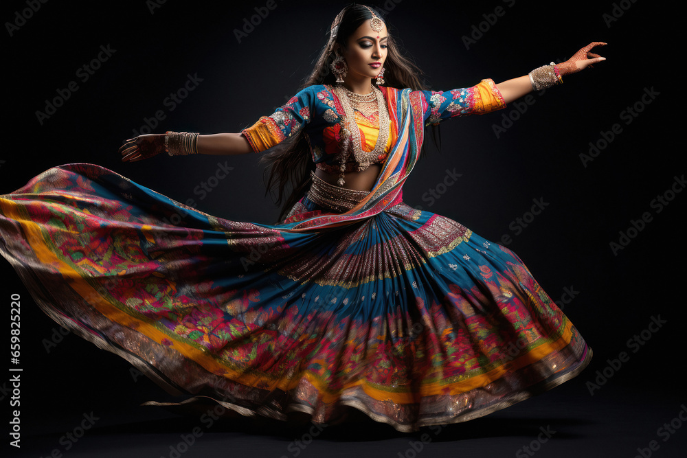 Young indian woman performing garba dance. Young indian woman performing garba dance.