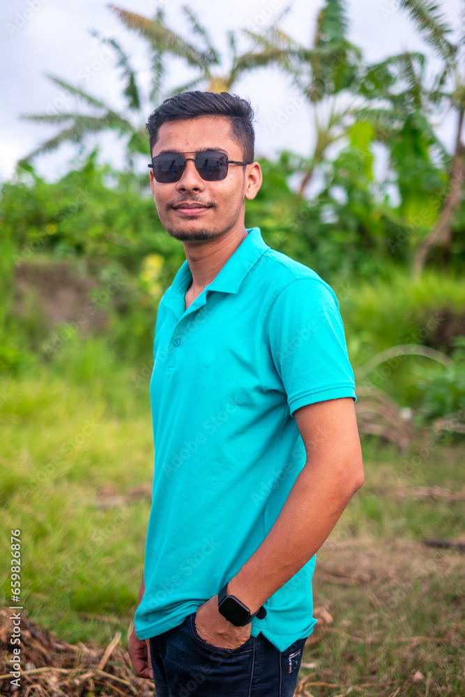 Portrait of south asian young handsome boy with black sunglass on his eye Portrait of south asian young handsome boy with black sunglass on his eye