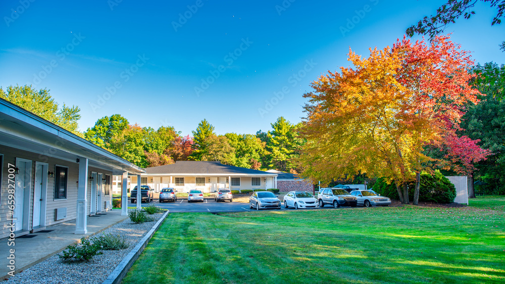A motel in the forest, autumn foliage season A motel in the forest, autumn foliage season