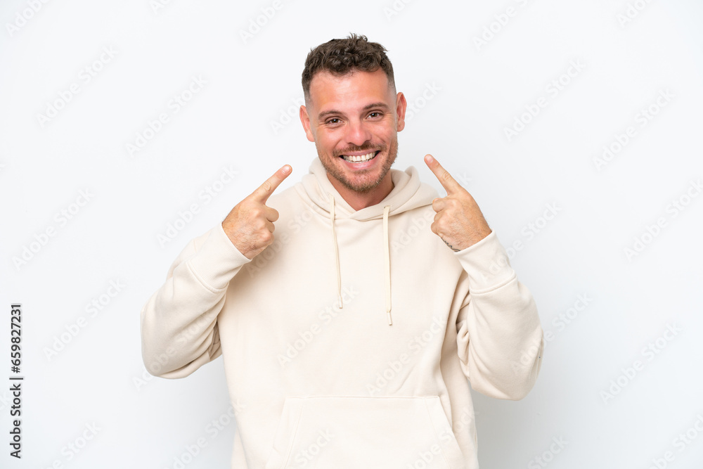 Young caucasian handsome man isolated on white background giving a thumbs up gesture Young caucasian handsome man isolated on white background giving a thumbs up gesture