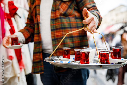 Photography Turkish tea in traditional glass mugs on a metal tray