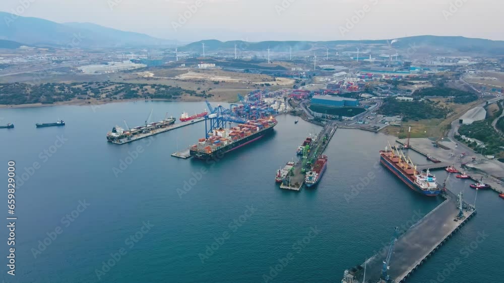 Aerial wide shot of Industrial port with container terminal with loading and unloading cargo ships Aerial wide shot of Industrial port with container terminal with loading and unloading cargo ships