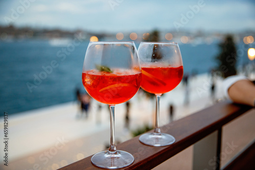 two aperol spritz on a summer evening in a mediterranean restaurant.